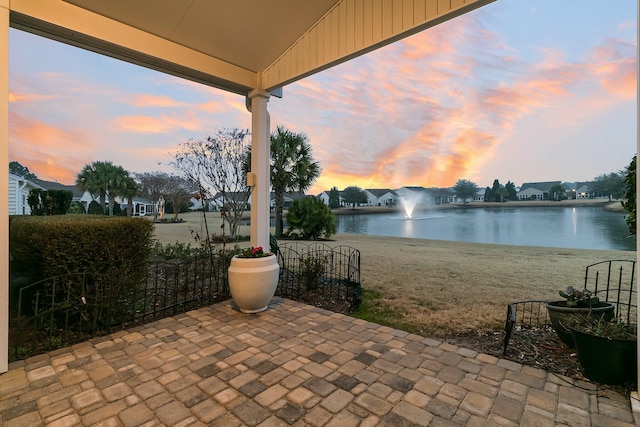 patio terrace at dusk with a water view