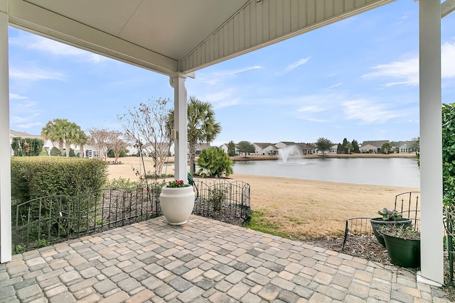 view of patio / terrace with a water view