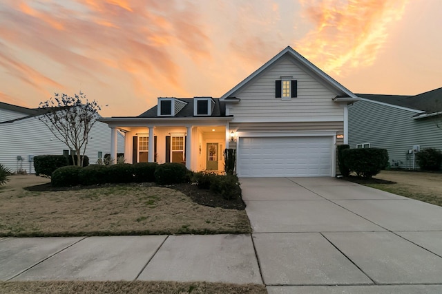 view of front facade with a garage and covered porch