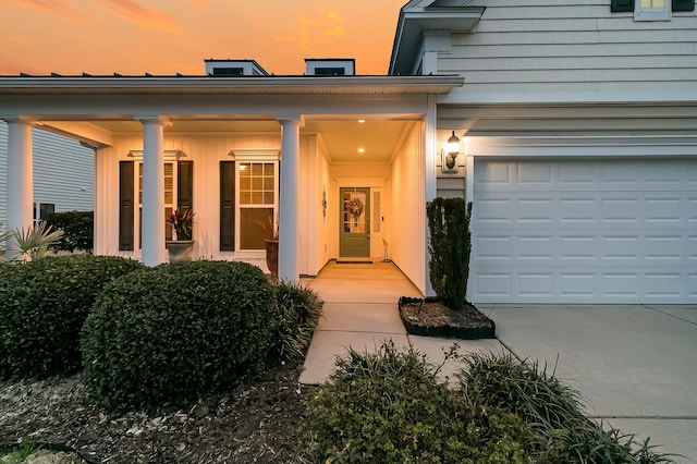 view of exterior entry at dusk