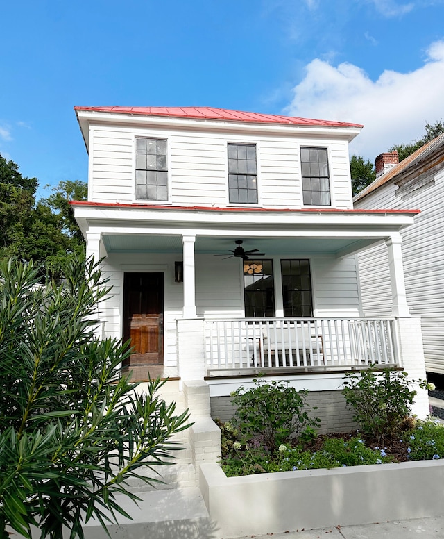 view of front of home featuring metal roof and covered porch