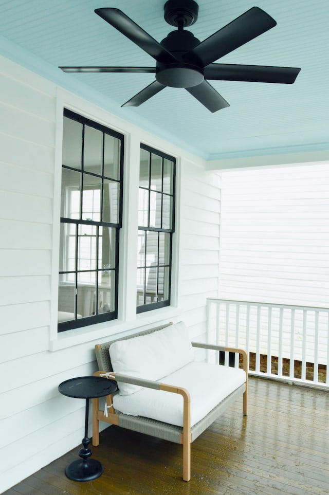 interior space with covered porch and a ceiling fan