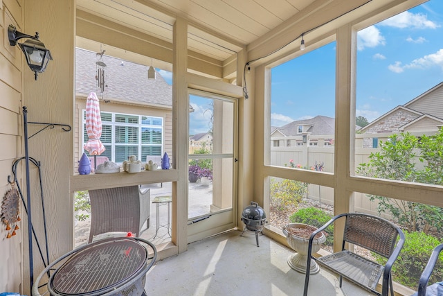 sunroom / solarium with concrete flooring