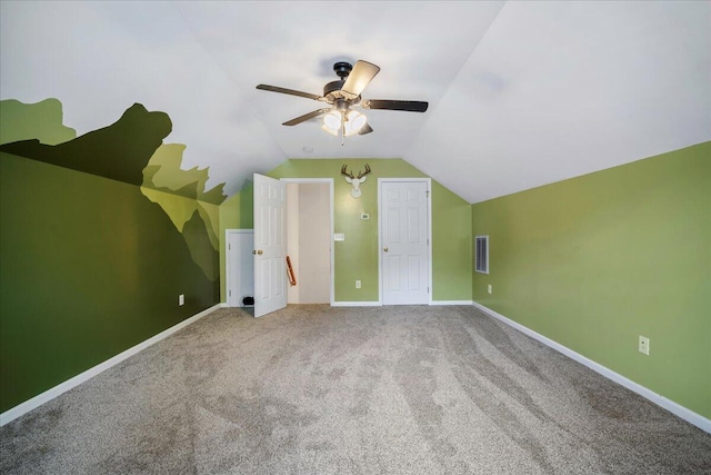 additional living space featuring vaulted ceiling, carpet flooring, and ceiling fan