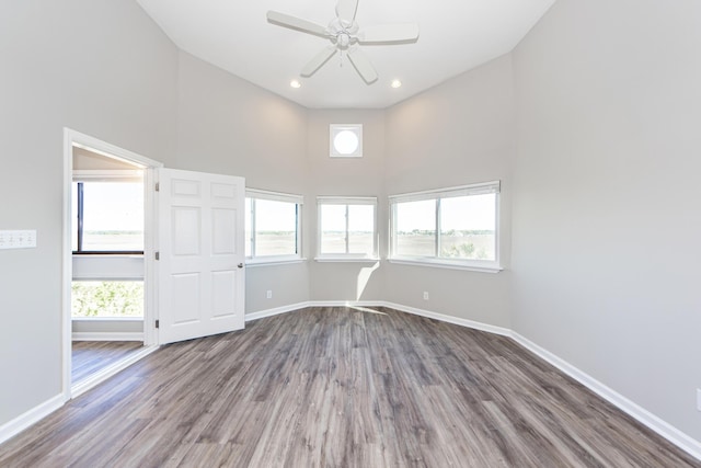 142 Marsh View Villas, Folly Beach, SC 29439 - empty room with a towering ceiling, baseboards, wood finished floors, ceiling fan, and recessed lighting