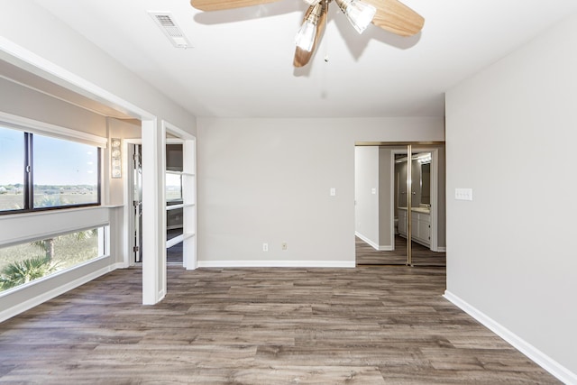 142 Marsh View Villas, Folly Beach, SC 29439 - spare room with ceiling fan, wood finished floors, and baseboards