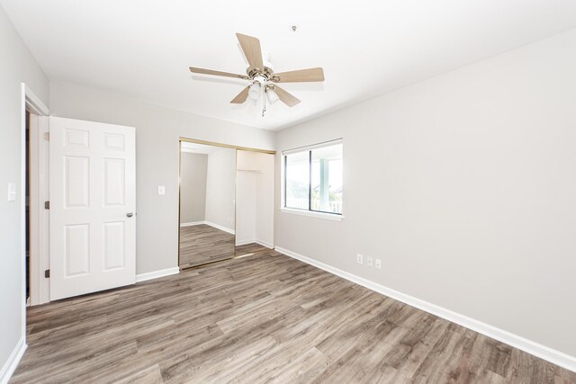 142 Marsh View Villas, Folly Beach, SC 29439 - unfurnished bedroom featuring baseboards, wood finished floors, a closet, and ceiling fan