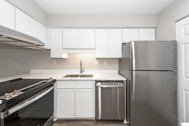 142 Marsh View Villas, Folly Beach, SC 29439 - kitchen featuring appliances with stainless steel finishes, a sink, light countertops, and white cabinets