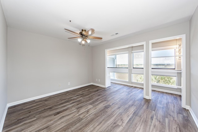 142 Marsh View Villas, Folly Beach, SC 29439 - spare room featuring dark wood-style floors, baseboards, and ceiling fan
