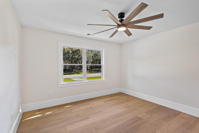 spare room featuring ceiling fan and light hardwood / wood-style flooring