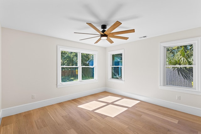 spare room with ceiling fan and light hardwood / wood-style floors