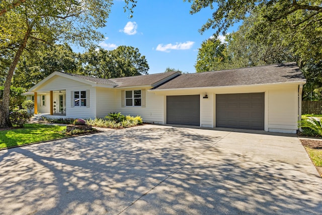 single story home with a garage