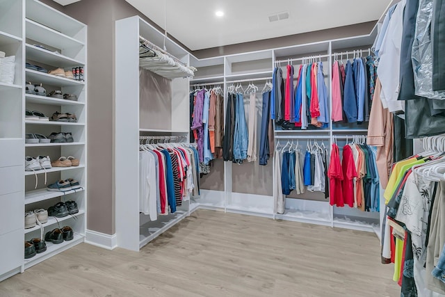 spacious closet featuring hardwood / wood-style floors