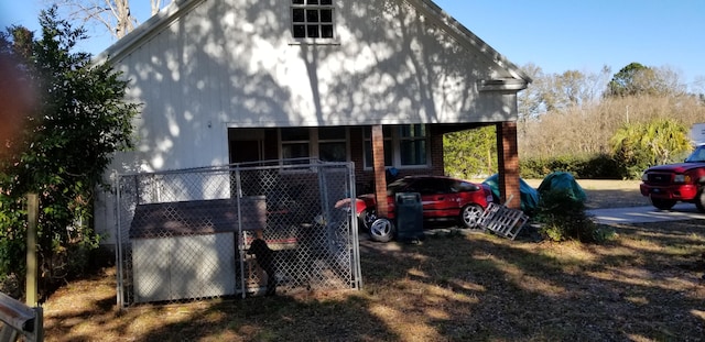 view of side of home featuring covered porch