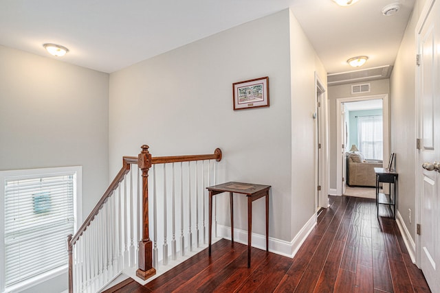 corridor featuring dark hardwood / wood-style floors