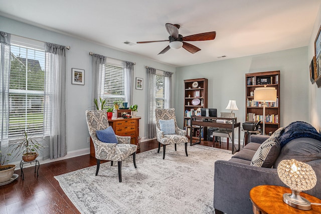 living room with dark hardwood / wood-style floors and ceiling fan