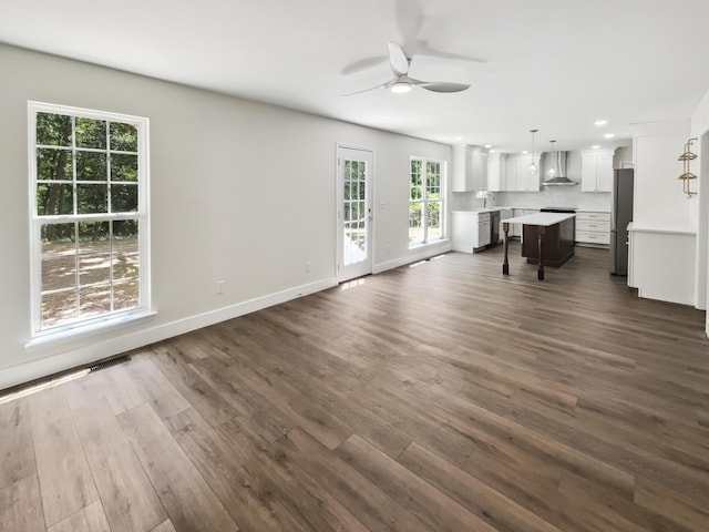 702 Spark St, Mount Pleasant, SC 29464 - unfurnished living room featuring a ceiling fan, dark wood finished floors, and recessed lighting