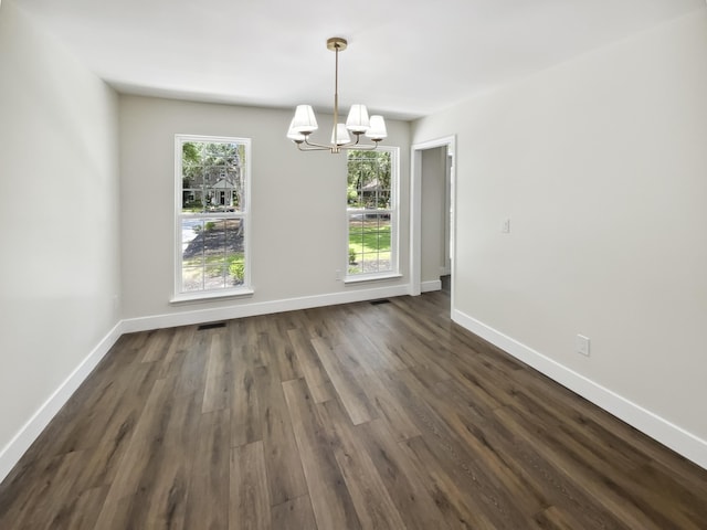 702 Spark St, Mount Pleasant, SC 29464 - unfurnished dining area with a chandelier and dark wood-style flooring