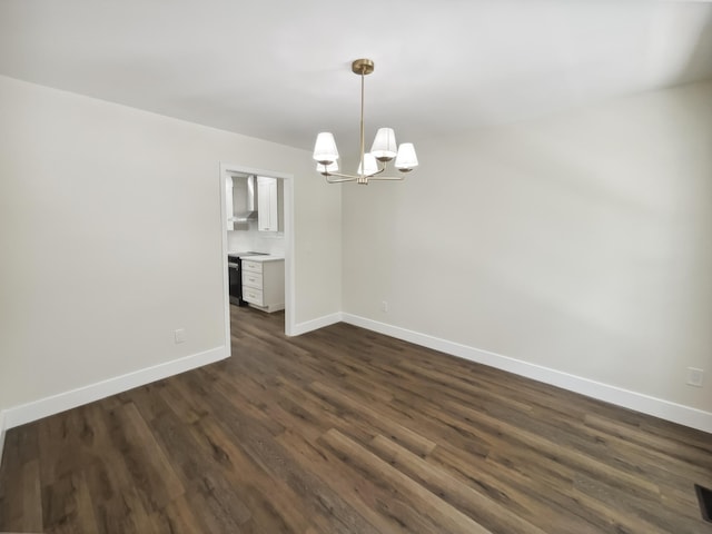 702 Spark St, Mount Pleasant, SC 29464 - spare room with a chandelier and dark wood-type flooring