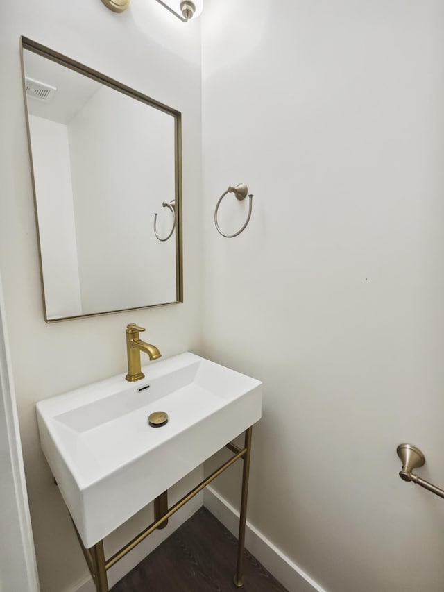 702 Spark St, Mount Pleasant, SC 29464 - bathroom with baseboards and a sink
