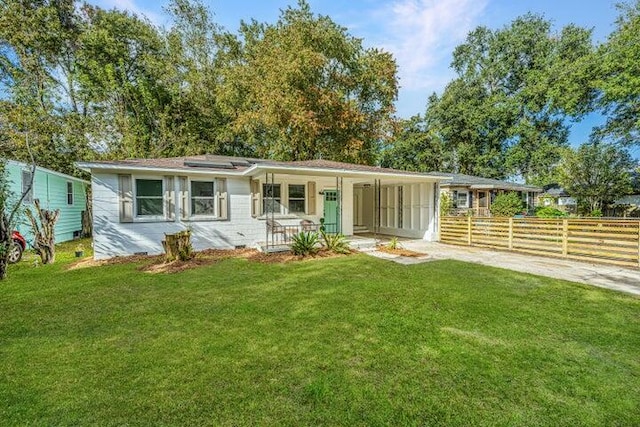 ranch-style house with a porch and a front yard