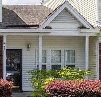 view of side of home with a porch