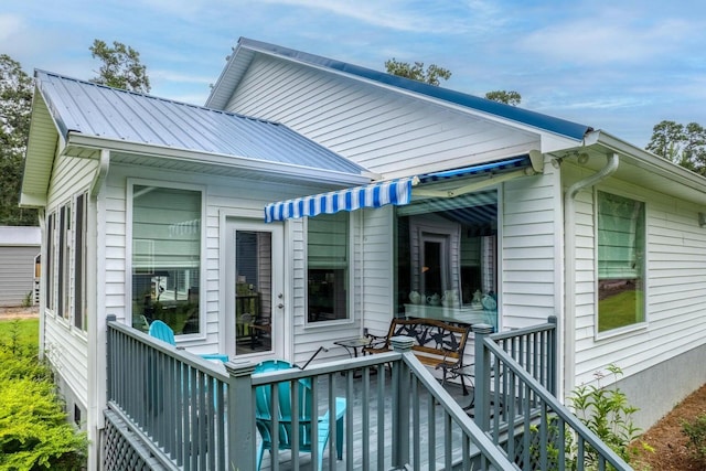 back of house featuring a deck