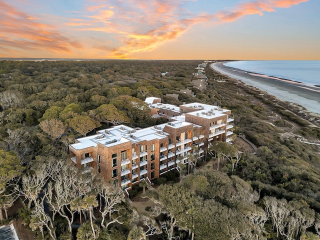 aerial view at dusk with a water view