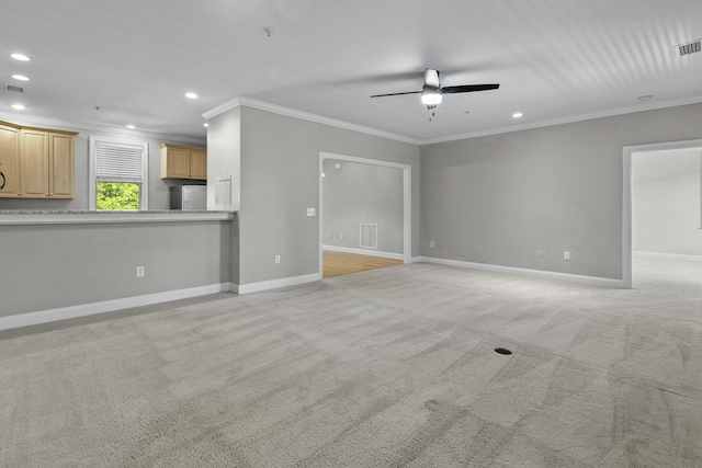 unfurnished living room with recessed lighting, ceiling fan, crown molding, and light carpet