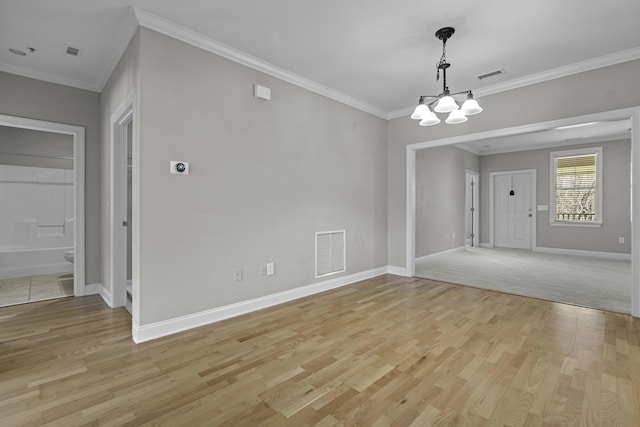 unfurnished dining area featuring baseboards, an inviting chandelier, visible vents, and light wood-style flooring