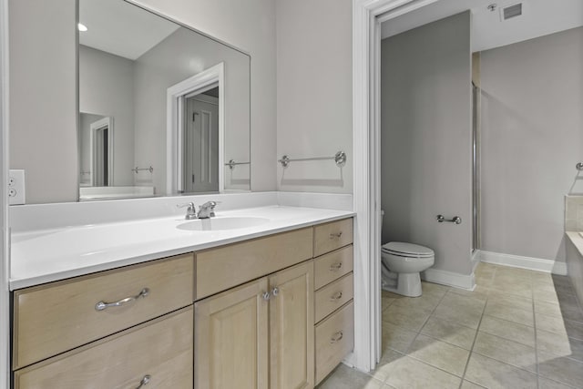 full bathroom featuring a shower stall, vanity, toilet, tile patterned flooring, and visible vents