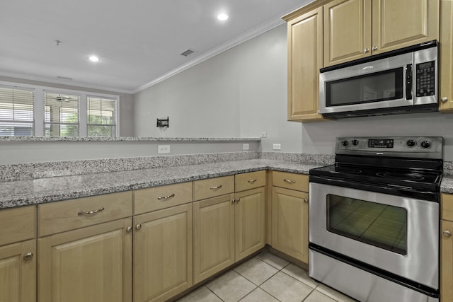 kitchen with appliances with stainless steel finishes, light brown cabinets, and ornamental molding