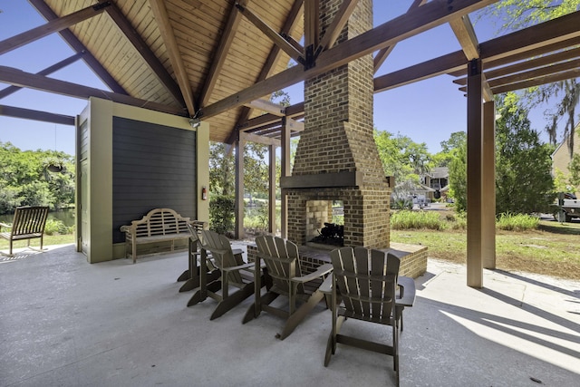 view of patio / terrace with an outdoor brick fireplace