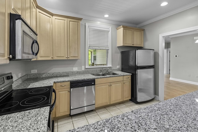 kitchen with stainless steel appliances, light brown cabinetry, a sink, light stone countertops, and ornamental molding