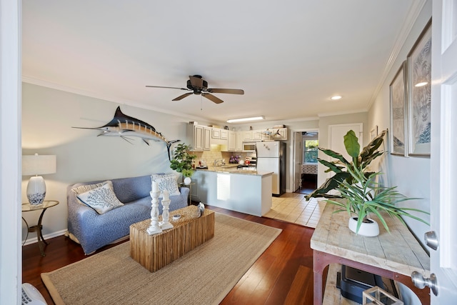 living room featuring crown molding and light hardwood / wood-style floors