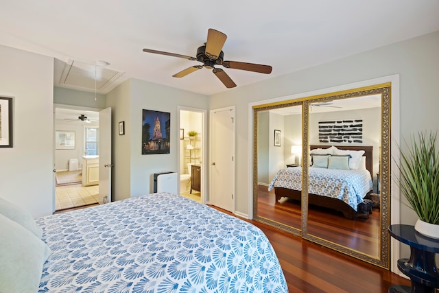 bedroom with ensuite bathroom, a closet, ceiling fan, and hardwood / wood-style flooring