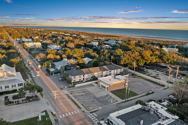 aerial view at dusk with a water view