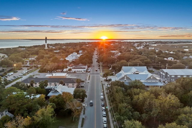 aerial view at dusk with a water view