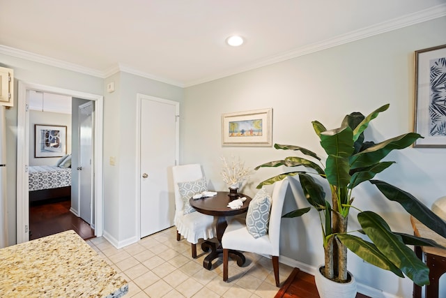 tiled dining space featuring crown molding