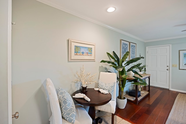 interior space with hardwood / wood-style flooring and ornamental molding