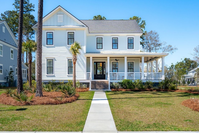 3858 Sawyers Island Dr, Mount Pleasant, SC 29466 - view of front of property with covered porch, board and batten siding, and a front yard