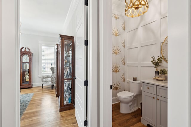 3858 Sawyers Island Dr, Mount Pleasant, SC 29466 - bathroom with vanity, an inviting chandelier, toilet, baseboards, and wood finished floors