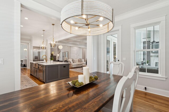 3858 Sawyers Island Dr, Mount Pleasant, SC 29466 - dining space featuring baseboards, wood finished floors, ornamental molding, and a chandelier