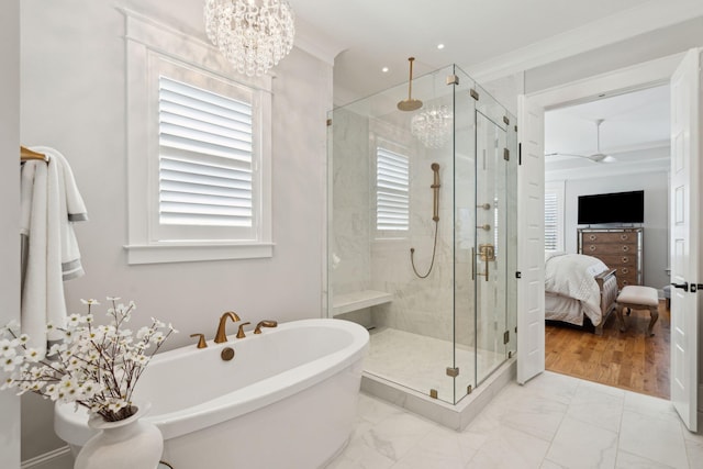 3858 Sawyers Island Dr, Mount Pleasant, SC 29466 - bathroom with marble finish floor, a stall shower, a soaking tub, and crown molding