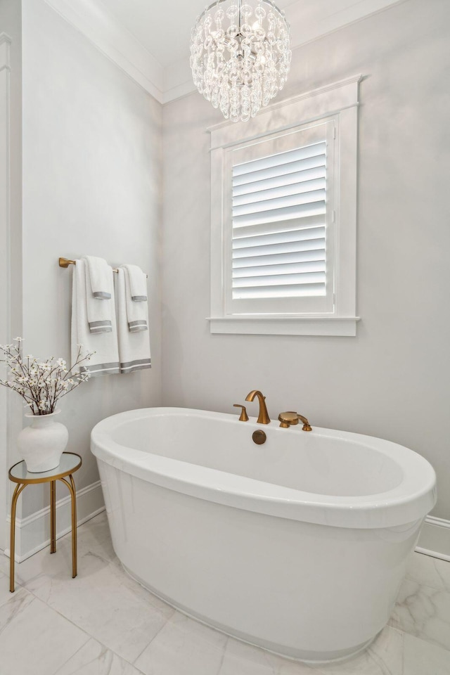3858 Sawyers Island Dr, Mount Pleasant, SC 29466 - full bathroom featuring marble finish floor, a notable chandelier, a freestanding bath, and ornamental molding