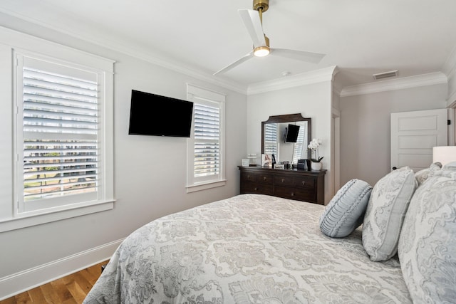 3858 Sawyers Island Dr, Mount Pleasant, SC 29466 - bedroom with visible vents, crown molding, baseboards, wood finished floors, and a ceiling fan