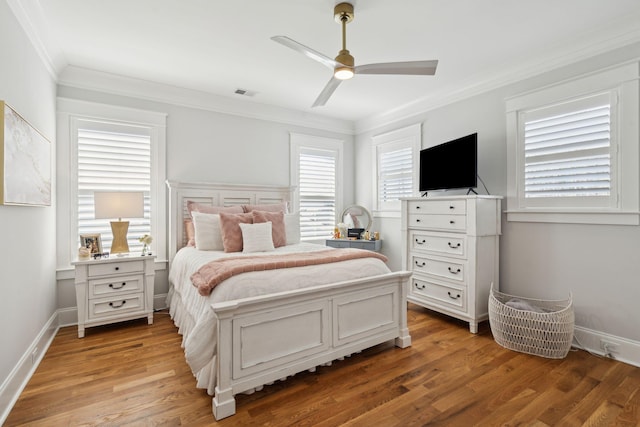 3858 Sawyers Island Dr, Mount Pleasant, SC 29466 - bedroom with ornamental molding, baseboards, light wood-style floors, visible vents, and a ceiling fan