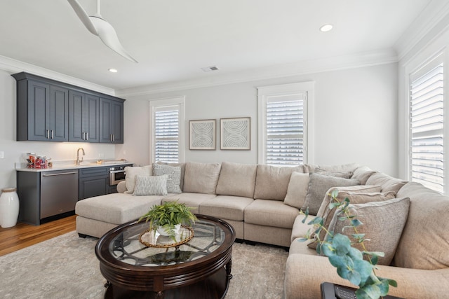3858 Sawyers Island Dr, Mount Pleasant, SC 29466 - living room with visible vents, indoor wet bar, crown molding, and a wealth of natural light