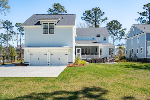 3858 Sawyers Island Dr, Mount Pleasant, SC 29466 - back of house featuring concrete driveway, fence, a shingled roof, a lawn, and a garage