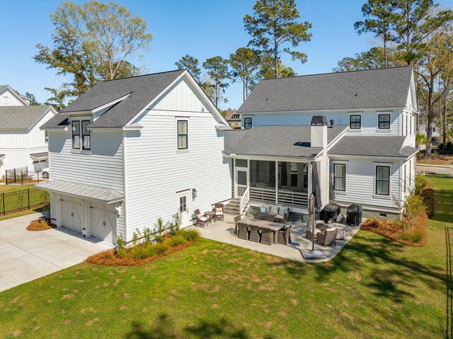 3858 Sawyers Island Dr, Mount Pleasant, SC 29466 - rear view of property with a lawn, a shingled roof, a sunroom, and a patio area